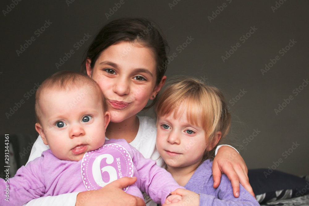 Close up Portrait of Three Beautiful Sisters, One Cute Toddler Girl , 6 Month Old Baby Girl, 7 Years Old Girl, Best Friends Forever, Happy family concept, The most Beautiful Girls, Princesses Close up Portrait of Three Beautiful Sisters, One Cute Toddler Girl , 6 Month Old Baby Girl, 7 Years Old Girl, Best Friends Forever, Happy family concept, The most Beautiful Girls, Princesses