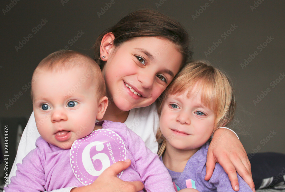 Close up Portrait of Three Beautiful Sisters, One Cute Toddler Girl , 6 Month Old Baby Girl, 7 Years Old Girl, Best Friends Forever, Happy family concept, The most Beautiful Girls, Princesses Close up Portrait of Three Beautiful Sisters, One Cute Toddler Girl , 6 Month Old Baby Girl, 7 Years Old Girl, Best Friends Forever, Happy family concept, The most Beautiful Girls, Princesses