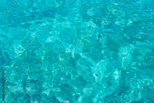 Turquoise blue sea water as a natural background texture.