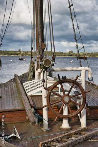 helm boat steering wheel of a old sailboat in Ireland.