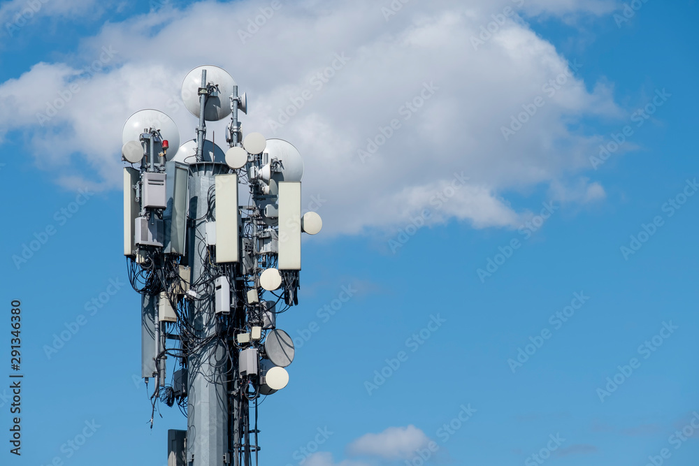 Cellular Base Station With Blue Sky And Clouds