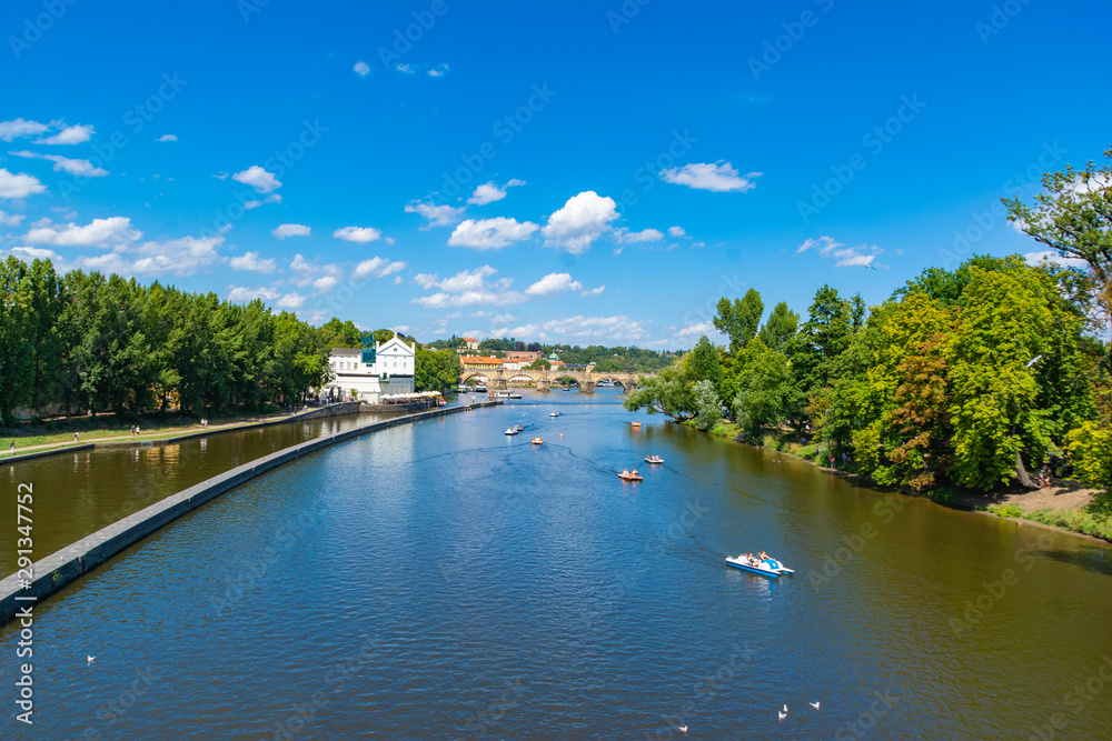 View of the river with a bypass and a lock. Warm summers and pleasure boats with tourists. View of the river with a bypass and a lock. Warm summers and pleasure boats with tourists.