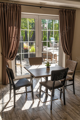 Big window with view of summer backyard