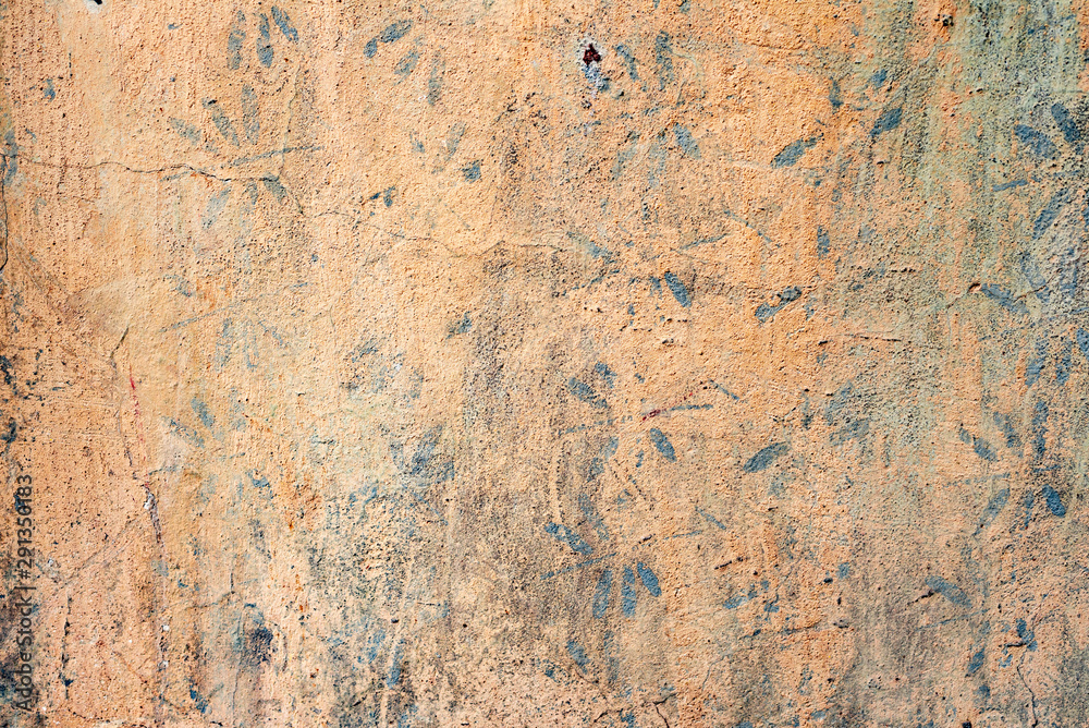 Texture of a concrete wall with cracks and scratches which can be used as a background