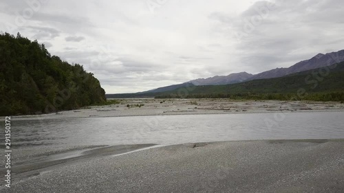 Wallpaper Mural Aerial footage of Alaskan river Delta being revealed behind rock shoreline Torontodigital.ca
