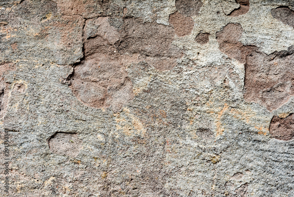 Texture of a concrete wall with cracks and scratches which can be used as a background