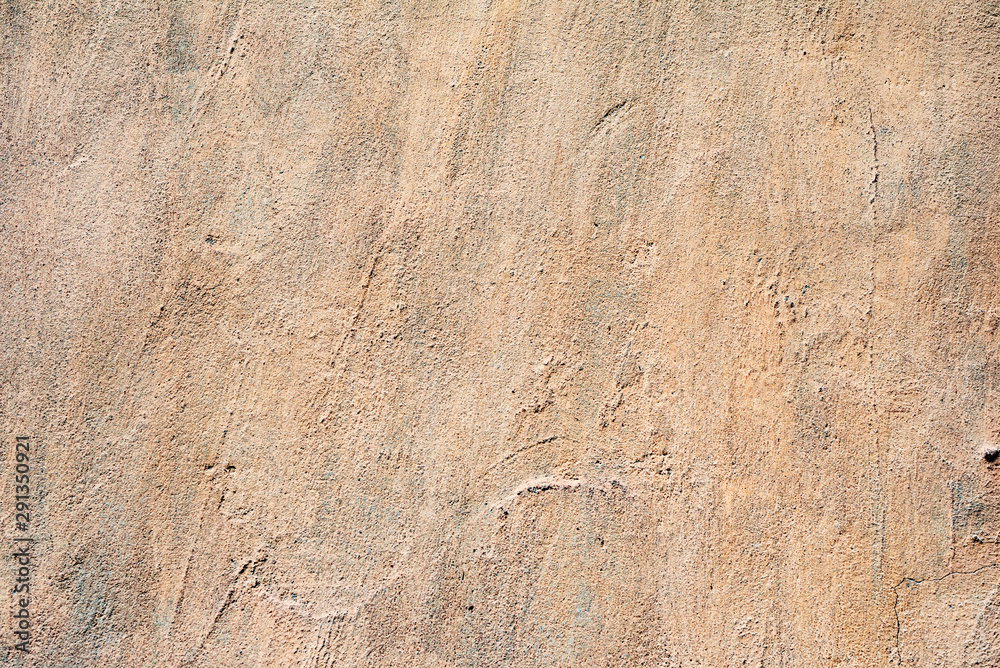 Texture of a concrete wall with cracks and scratches which can be used as a background Texture of a concrete wall with cracks and scratches which can be used as a background