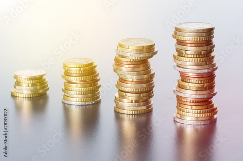 Money concept: Coins tacked on each other. Inflation, currency, savings, money