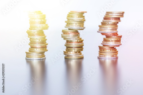 Money concept: Coins tacked on each other. Inflation, currency, savings, money photo