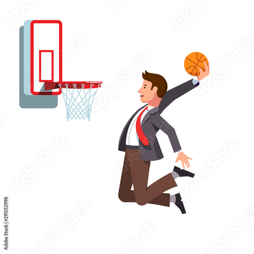 Business man performing basketball hoop slam dunk