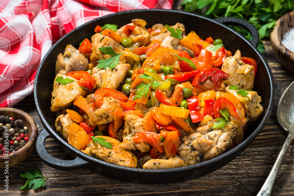 Chicken Stir fry with vegetables on wooden table. Chicken Stir fry with vegetables on wooden table.