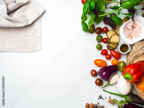 Italian food background, Ingredients for cooking pasta or pizza, vegetables as eggplant, cherry tomatoes, bell peppers,basil, olive oil, saltand spices, top view