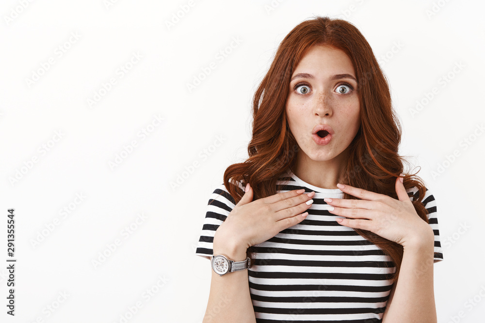 Close-up surprised and impressed wondered ginger girl in striped t-shirt, gasping amazed, folding lips, pouting astonished, hold hands on chest ambushed, stare camera with amazement Close-up surprised and impressed wondered ginger girl in striped t-shirt, gasping amazed, folding lips, pouting astonished, hold hands on chest ambushed, stare camera with amazement