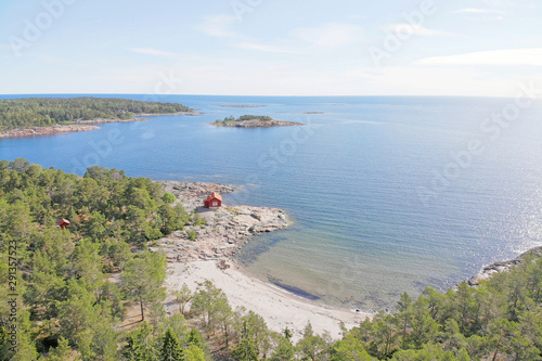 Photography The beautiful swedish archipelago, the sea, trees, islets and red traditional co