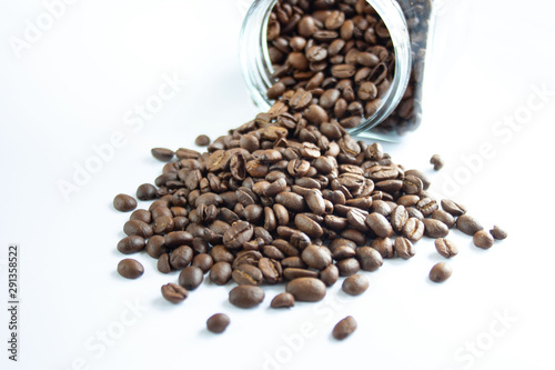 Coffee beans spilling out of the jar  white background