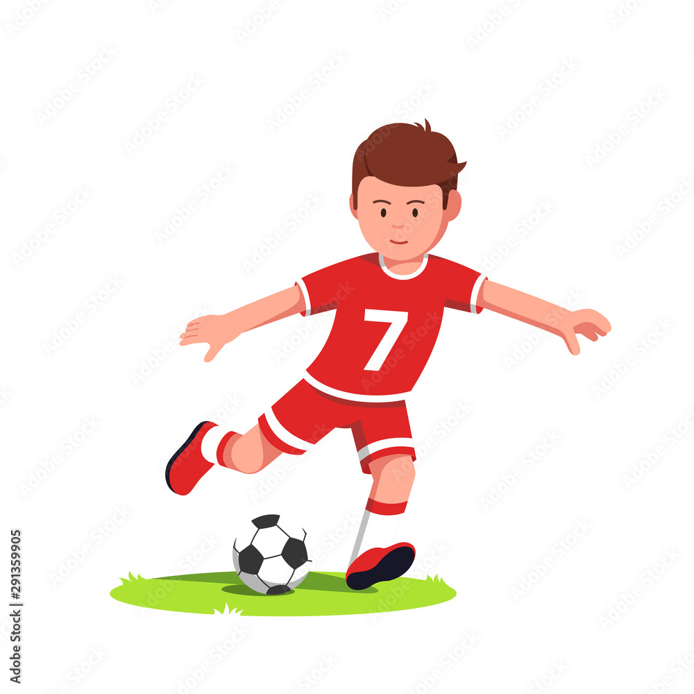 Teenage soccer player boy playing and kicking ball