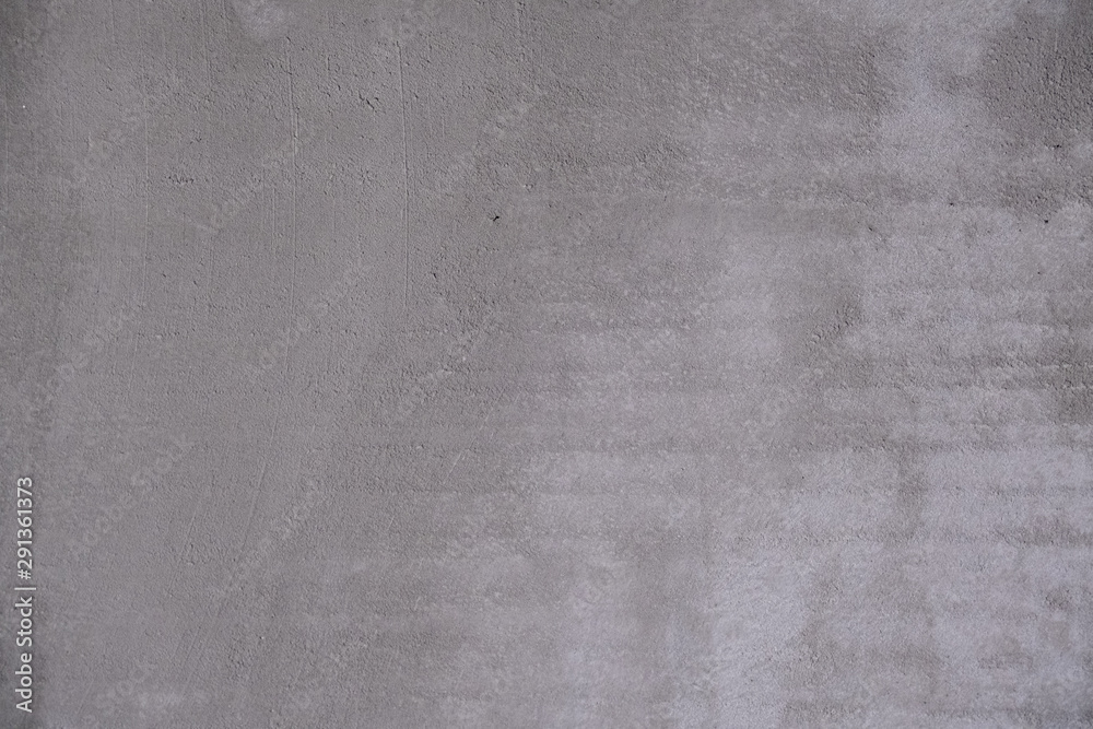 Fototapeta premium Abstract gray background. Rough concrete wall covered with cement