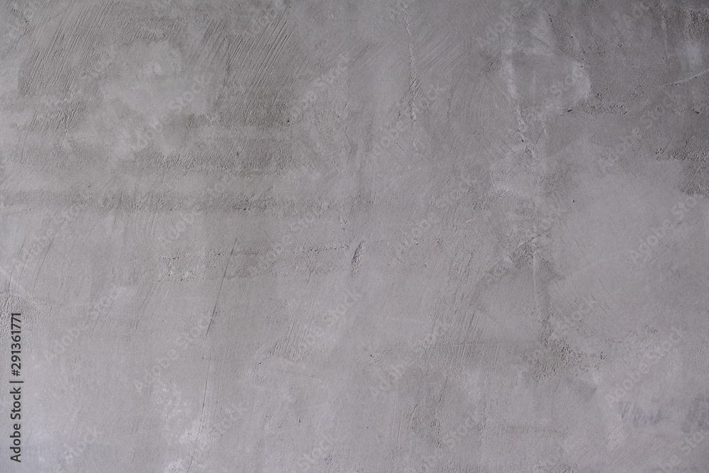 Naklejka premium Abstract gray background. Rough concrete wall covered with cement