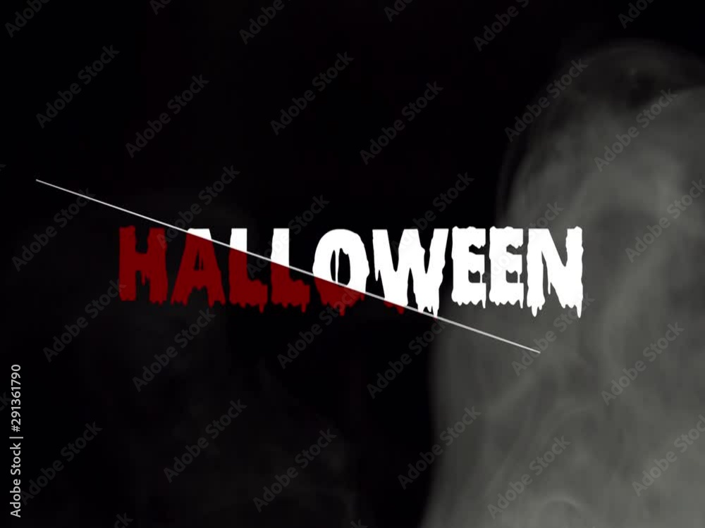 Buon Halloween: scritta tagliata a metà, sangue pendente e fumo