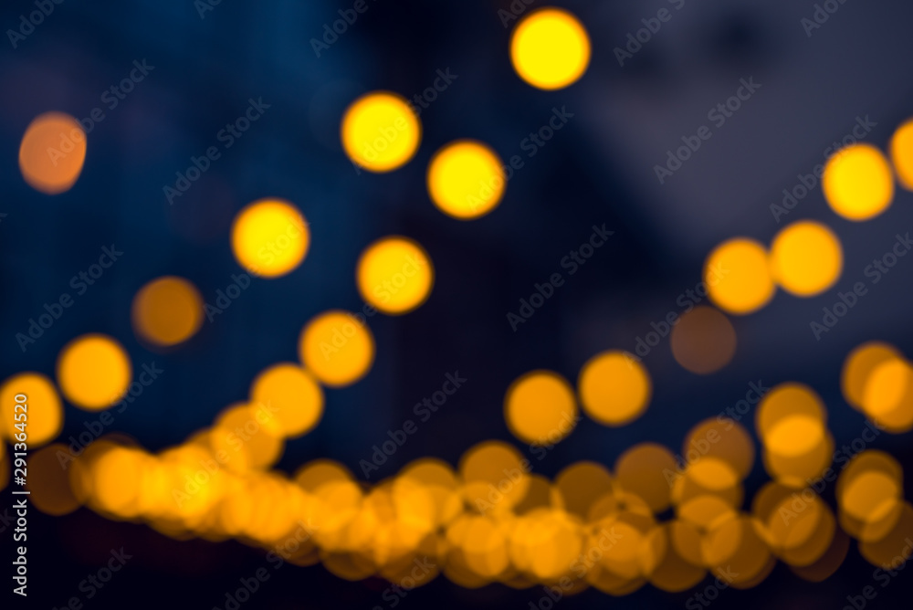 Fototapeta premium Dark abstract background with bright gold bokeh