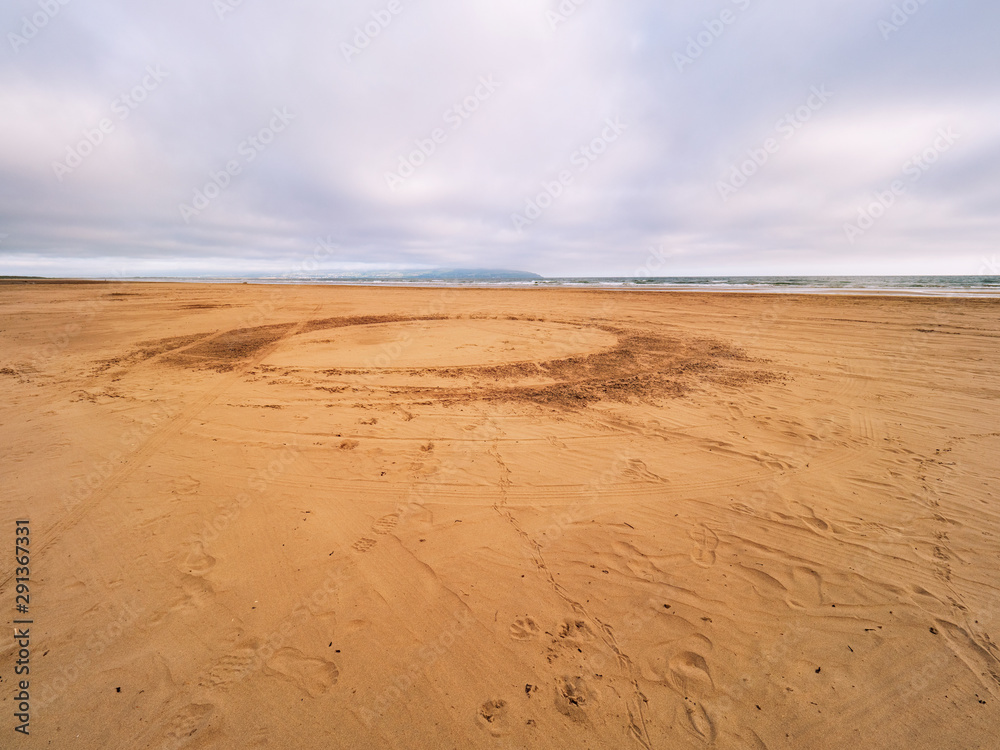 wide angle shoot summer morning sand beach in the north coastline of Northern Ireland