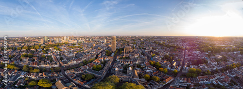 Super wide panoramic aerial view of the medieval Dutch city centre of Utrecht with cathedral towering over the city at early morning sunrise. Cityscape in The Netherlands