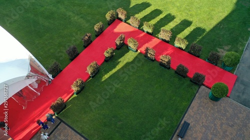 Red carpet in a country cottage. Suburban home ownership aerial shot. photo