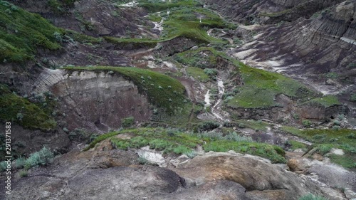 Horsethief canyon in Alberta Canada, slowmo 120fps tilt up foreground to wide scene photo