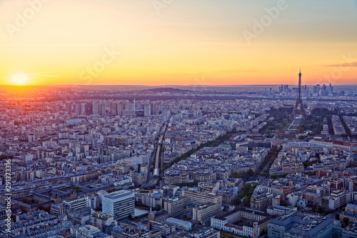 Eiffel Tower and business district of Defense at orange sunset, as seen from Montparnasse Tower, Paris, France © JEROME LABOUYRIE