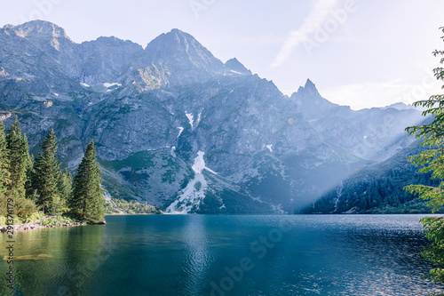 Lake in mountains with blue water. rocky peaks of mountains.