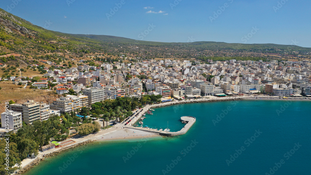 Aerial drone photo of famous seaside area and main town of Loutraki with sandy organised beach with turquoise clear sea and resorts, Greece Aerial drone photo of famous seaside area and main town of Loutraki with sandy organised beach with turquoise clear sea and resorts, Greece