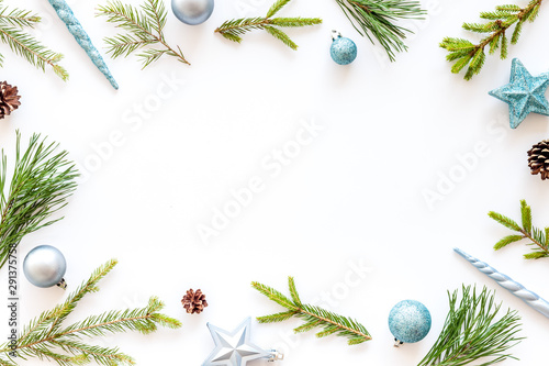 New Year decorative mockup. Fir branches and festive toys frame on white background top view copy space