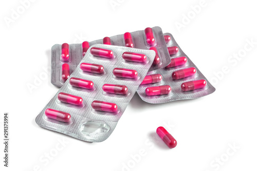 Fototapet Several blister packs with pink capsules