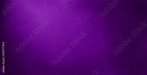 Purple background with spotlight on textured black wall, elegant old vintage background design with soft lighting