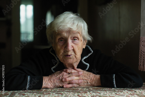 Portrait of elderly meloncholic pensioner woman.