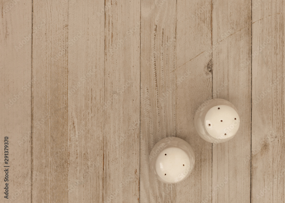 salt and pepper on the wood rustic table salt and pepper on the wood rustic table
