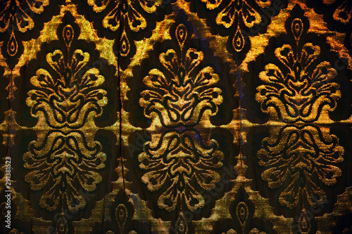 Arabic pattern on the fabric of the sofa, background. Texture of arab ornament