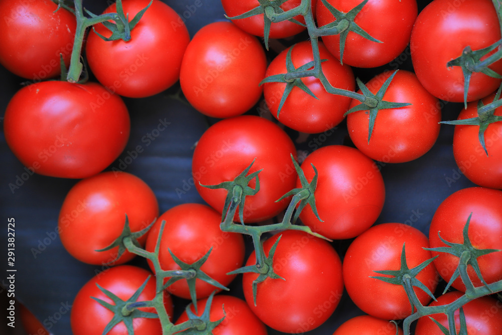 Red tomatoes close up on the market