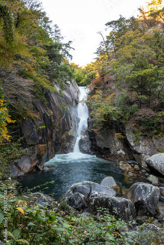 Senga Waterfall   Sengataki    A waterfall in Mitake Shosenkyo Gorge. Autumn foliage scenery view in sunny day. A popular tourist attractions in Kofu  Yamanashi Prefecture  Japan