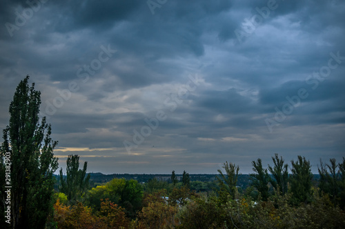 Autumn urban landscape on a Sunny day - yellow and colorful autumn trees  the sky with clouds with autumn haze