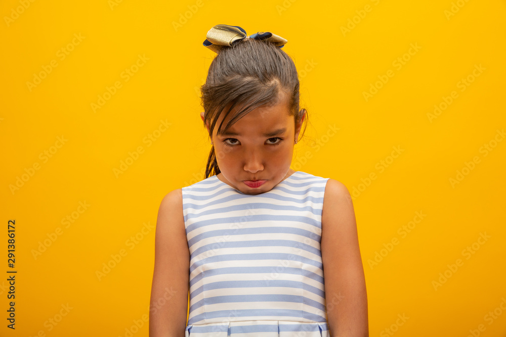 Asian girl sad about someone or situation. Sad about something. Bad news. Asian girl sad about someone or situation. Sad about something. Bad news.