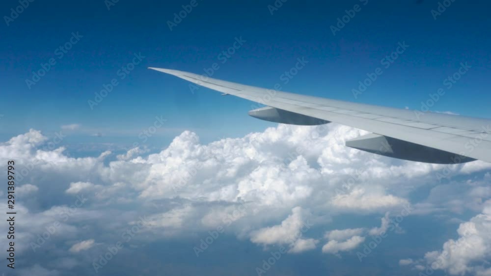 view from airplane window. Wing of an airplane. above the clouds view from airplane window. Wing of an airplane. above the clouds