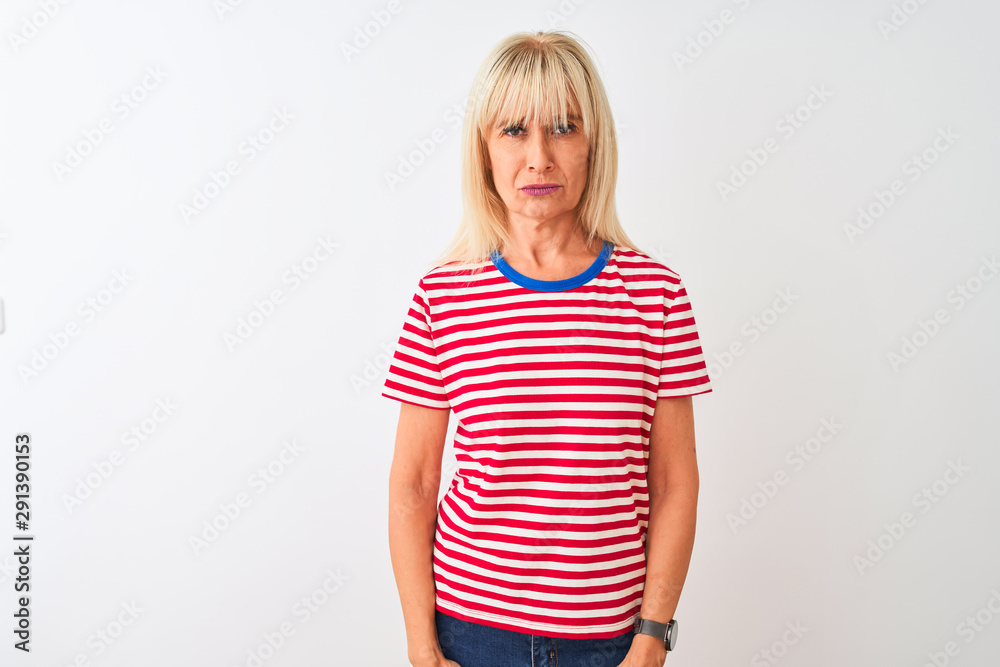 Middle age woman wearing casual striped t-shirt standing over isolated white background depressed and worry for distress, crying angry and afraid. Sad expression. Middle age woman wearing casual striped t-shirt standing over isolated white background depressed and worry for distress, crying angry and afraid. Sad expression.