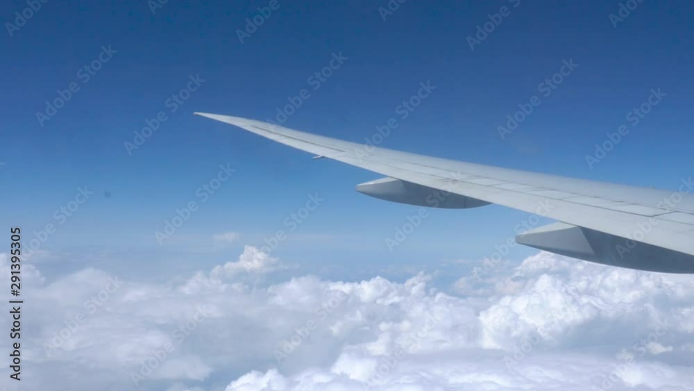 view from airplane window. Wing of an airplane. above the clouds view from airplane window. Wing of an airplane. above the clouds
