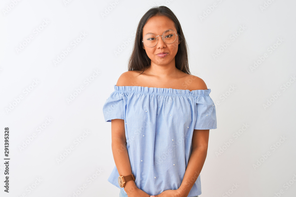 Young chinese woman wearing blue t-shirt and glasses over isolated white background depressed and worry for distress, crying angry and afraid. Sad expression. Young chinese woman wearing blue t-shirt and glasses over isolated white background depressed and worry for distress, crying angry and afraid. Sad expression.