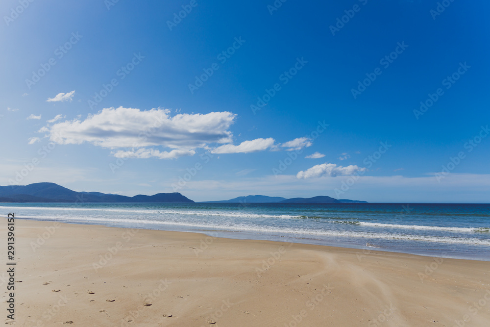 sunny pristine and deserted beach overlooking the South Pacific Ocean