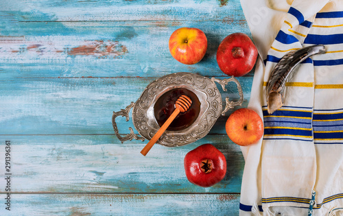 Honey, apple and pomegranate traditional holiday symbols rosh hashanah jewish holiday photo