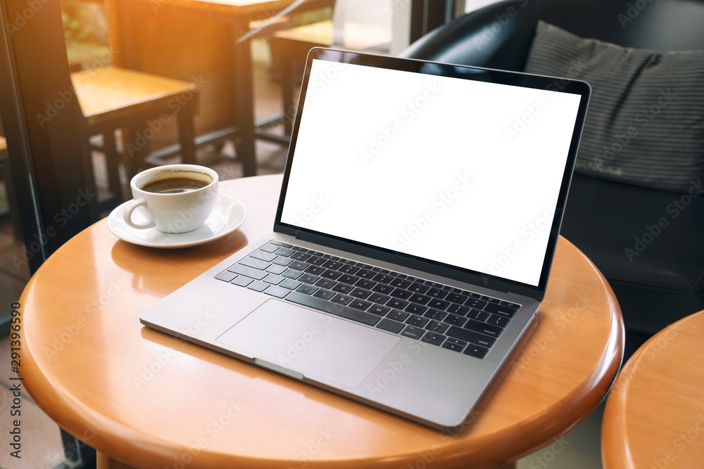 Mockup image of laptop computer with blank white desktop screen on wooden table Mockup image of laptop computer with blank white desktop screen on wooden table