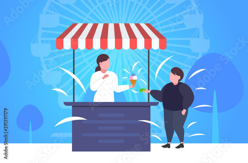 fat obese boy buying ice cream at food stall unhealthy nutrition obesity concept guy having fun public park ferris wheel landscape background full length flat horizontal