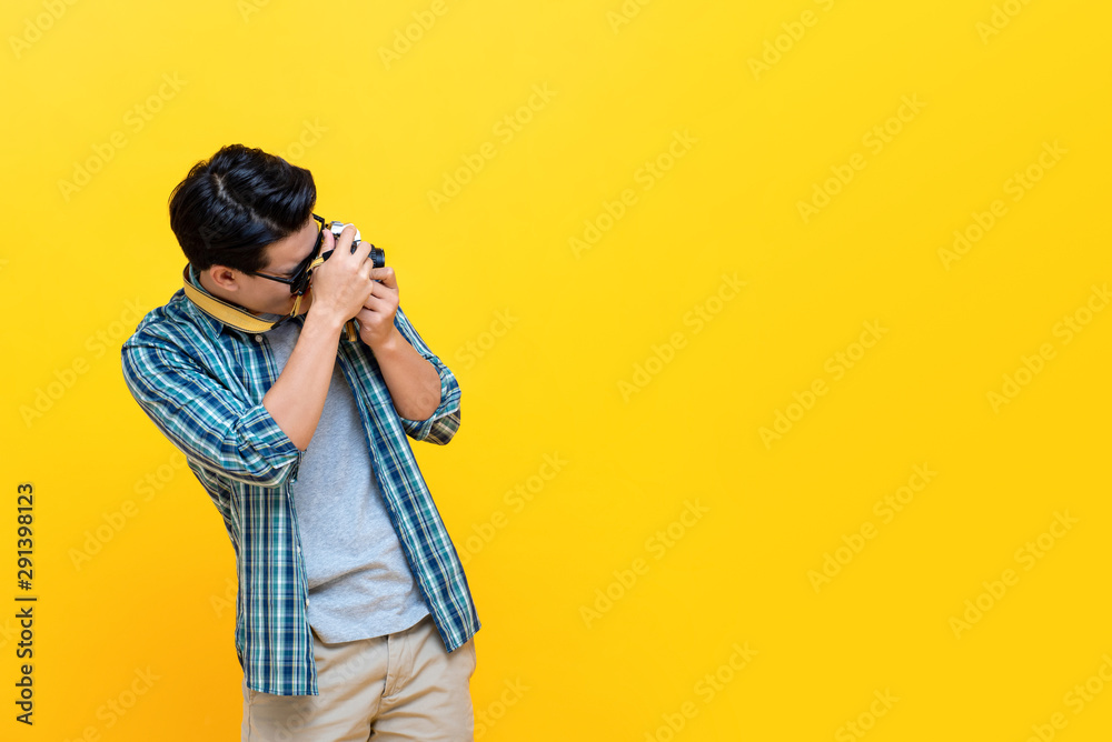 Tourist photographer clicking pictures using camera Tourist photographer clicking pictures using camera